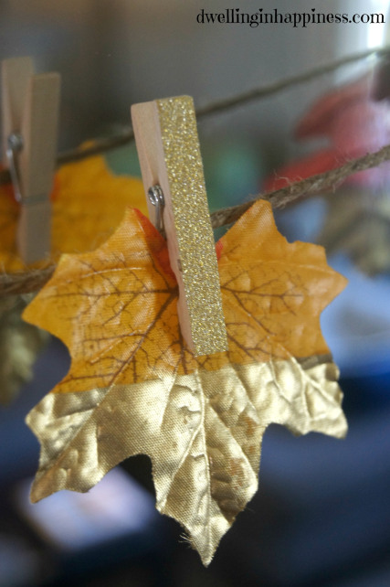 Fall leaf hanging up with a glitter clothespin.