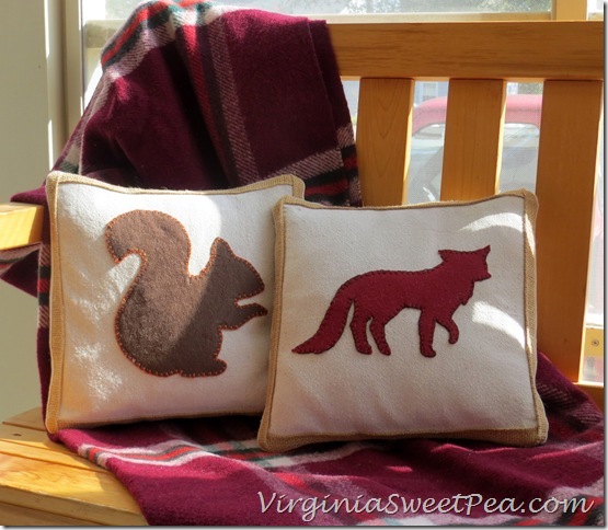 Squirrel and Fox Pillows on the porch chair.