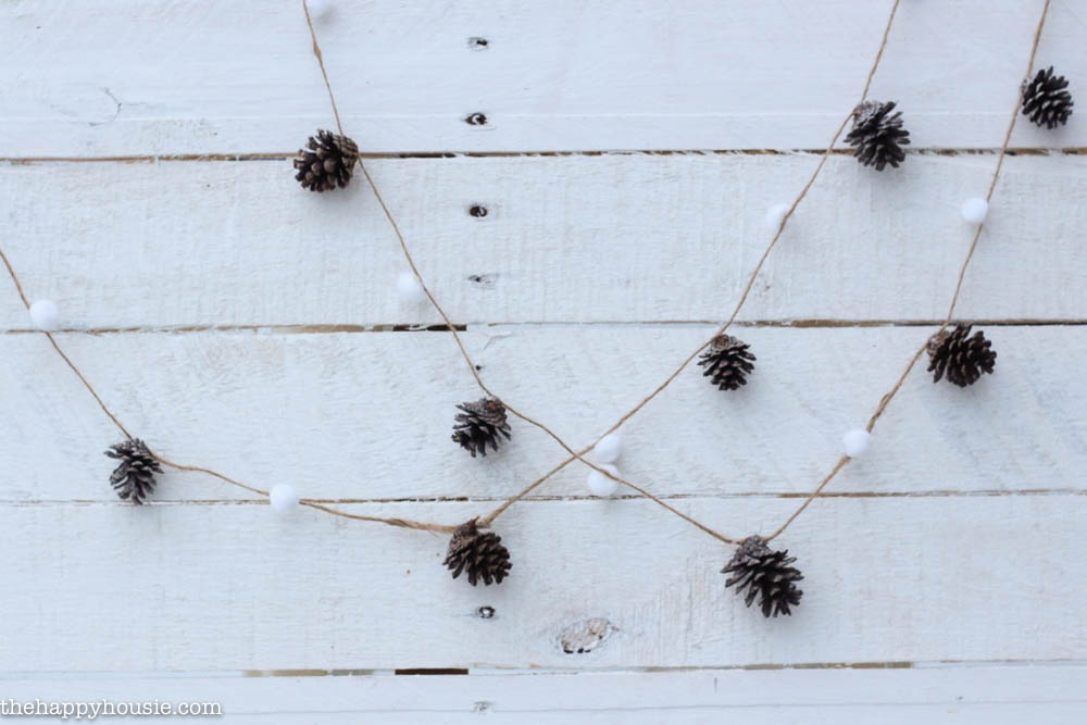 DIY Pom Pom & Pine Cone Garland for the holidays by thehappyhousie.com for Classy Clutter-1