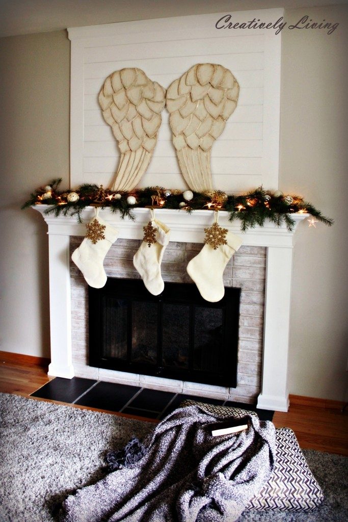 Angel wings above the fireplace in the living room.