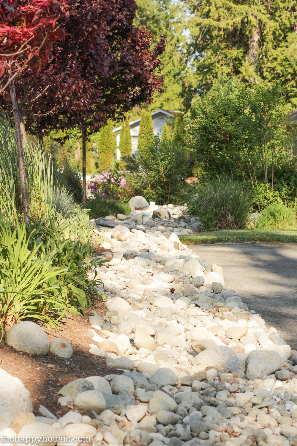 landscaping with river rock & dry river rock garden ideas